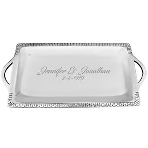 May include: A rectangular silver serving tray with handles. The tray has a textured border and engraved text that reads "Jennifer & Jonathan" and "2-8-1979".