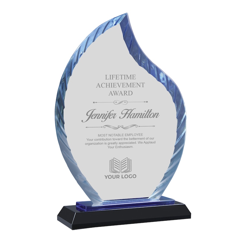 May include: A blue glass award in the shape of a flame with the text "LIFETIME ACHIEVEMENT AWARD" and "Jennifer Hamilton" on it. The award also includes the text "MOST NOTABLE EMPLOYEE" and "YOUR LOGO".