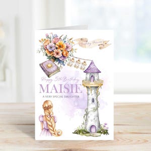 May include: A greeting card with a watercolor illustration. The card features a lighthouse, flowers, and the text "Happy 5th Birthday Maisie, A Very Special Daughter." The design includes a banner that reads "Birthday Princess."