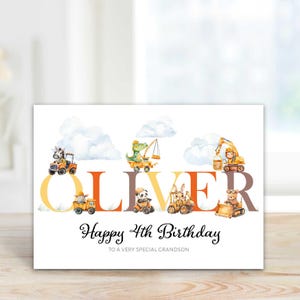 May include: A birthday card with the name "OLIVER" in large, colorful letters. The card features illustrations of construction vehicles driven by animals, with the text "Happy 4th Birthday" and "TO A VERY SPECIAL GRANDSON".