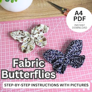 May include: A printable PDF pattern for making fabric butterflies. The pattern includes step-by-step instructions with pictures. The image shows two finished fabric butterflies, one with a floral print and one with a blue and white print.