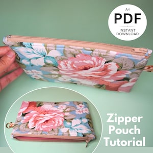 May include: A floral zipper pouch tutorial in PDF format. The pouch is made with a blue fabric with pink and white flowers. The tutorial is available for instant download.