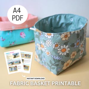 May include: A printable PDF pattern for a fabric basket. The pattern is for an A4 size basket with a daisy print. The image shows two baskets, one in pink and blue and the other in green and white.
