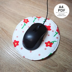 May include: A black Acer computer mouse rests on a round white mousepad. The mousepad features a floral pattern with red flowers, green stems, and pink polka dots. The image also includes a white circle with the text "A4 PDF" and "INSTANT DOWNLOAD".