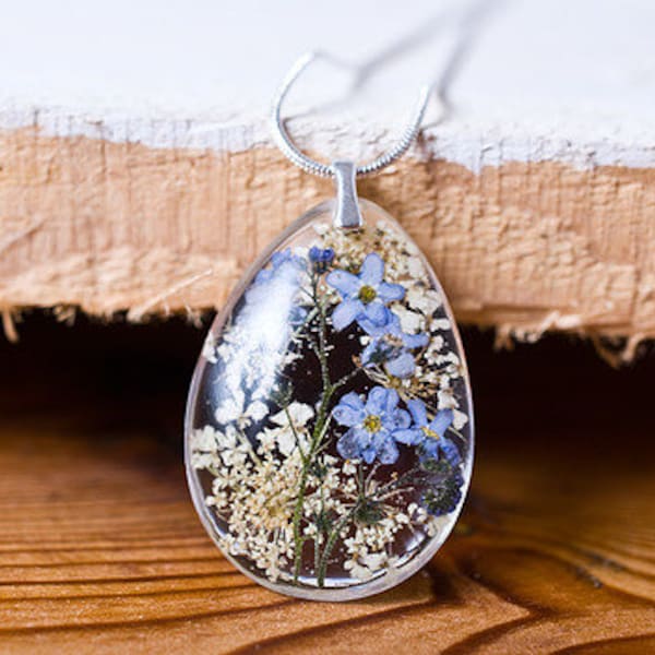 Delicate red resin pendant with pressed forget me nots: