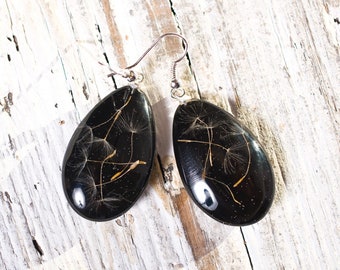 Delicate black earrings with dried dandelion.