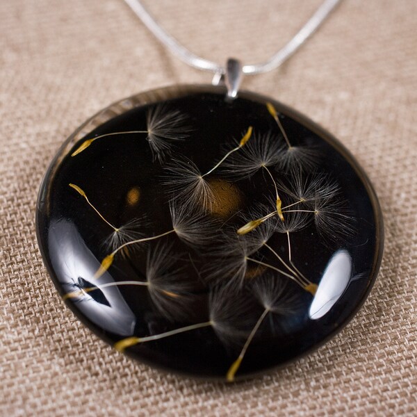 Delicate black resin pendant with beautiful dandelion seeds