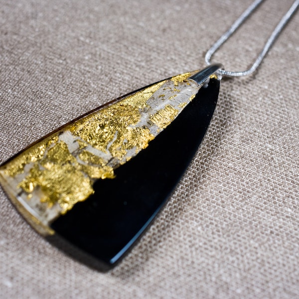 Delicate resin pendant with real wood and 23 carat gold