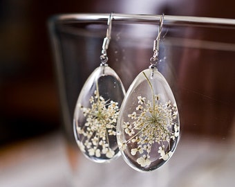 Delicate earrings with pressed real flower.