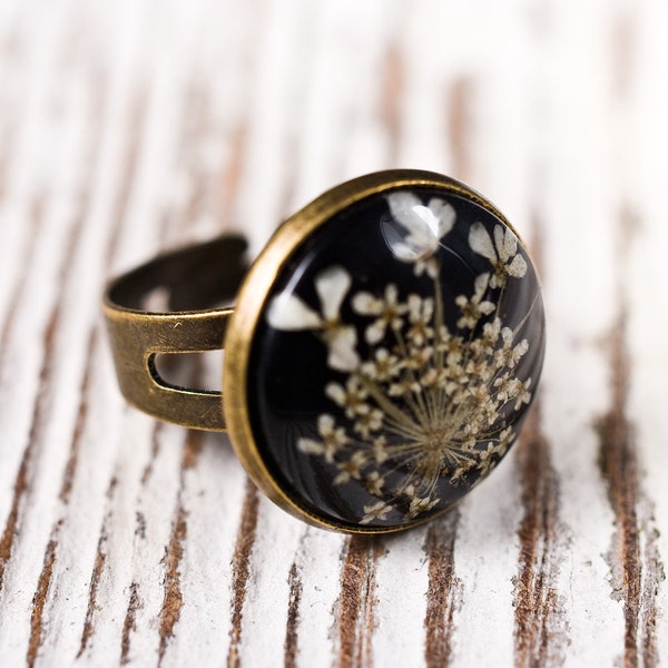 Delicate resin ring with white flower