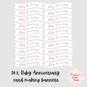 May include: Twenty white banner shapes with the text "Ruby Anniversary" in red cursive writing. The banners are arranged in two columns. The text "20 x Ruby Anniversary card making banners" is below the banners. The text "Poppy's Crafty Picks" is in the lower right corner.