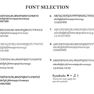 May include: A chart showing nine different font styles for a personalized item. The font styles are labeled 1 through 9. The chart also includes a section for symbols, which includes a heart, infinity symbol, music note, and a cross. The text below the symbols reads "Extra fee may apply for special symbols."