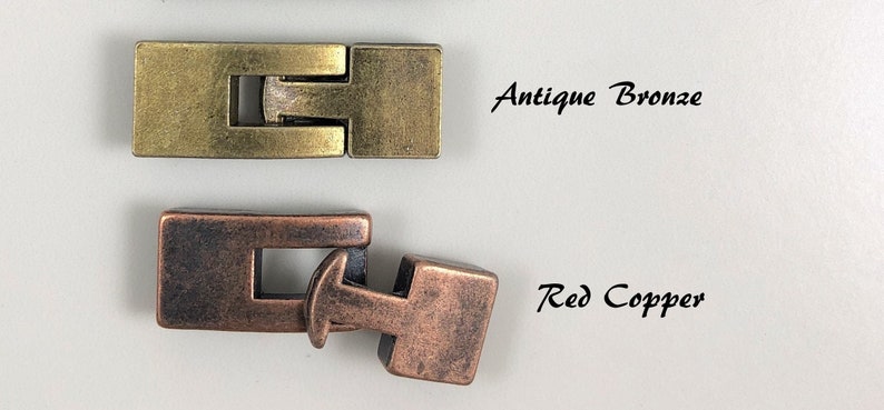 May include: Two metal clasps, one in antique bronze and one in red copper. The clasps are designed to be used for jewelry making.