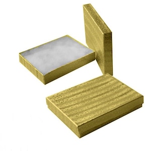 May include: Three gold gift boxes with a textured finish. The boxes are empty and have a white lining.