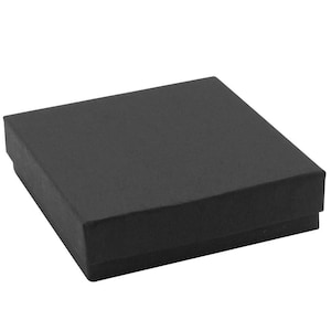 May include: A square, matte black gift box with a lid. The box features a simple, clean design with sharp edges and a flat top surface. It is a solid, dark-colored container intended for holding small items, presented from a high-angle perspective.