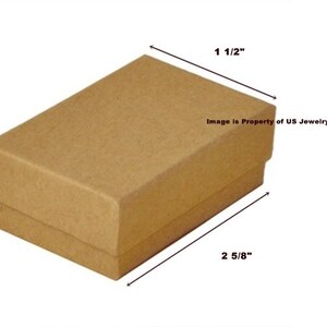May include: A brown cardboard box with dimensions of 1 inch by 1 1/2 inches by 2 5/8 inches. The box is ideal for packaging small items.