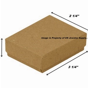 May include: A brown cardboard box with a lid, measuring 3 1/4 inches by 2 1/4 inches by 1 inch. The box is ideal for packaging small items, such as jewelry or other trinkets.
