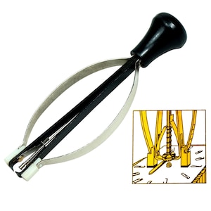 May include: A watch hand remover tool with a black handle and a silver-colored, curved metal frame. The tool has a white plastic piece at the end and a small screw. A diagram of the tool in use is in the lower right corner.
