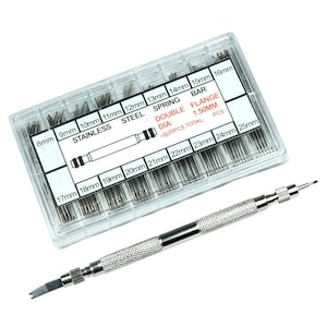May include: A clear plastic box filled with assorted sizes of stainless steel spring bars for watch repair. The box includes a tool for installing and removing spring bars. The box is labeled with the sizes of the spring bars in millimeters.