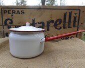 White enamel pot with red trim
