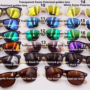 May include: A collection of 17 pairs of sunglasses with different frame and lens colors. The sunglasses are arranged in rows, with the numbers 1 through 17 labeling each pair. The frames are made of plastic, wood, and tortoise shell. The lenses are polarized and come in colors such as gold, blue, green, red, silver, gray, and tan.