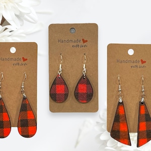 May include: Three pairs of red and black plaid dangle earrings on brown card stock with the text "Handmade with love" printed on each card.