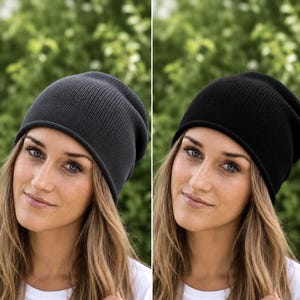 May include: A charcoal grey knit beanie and a black knit beanie, both featuring a simple, smooth texture with a rounded crown and a slightly rolled edge, designed to fit snugly on the head with a clean, uniform appearance in two colors.
