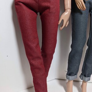 May include: A pair of red denim pants with a straight leg fit. The pants are made of a soft, comfortable fabric and have a classic look.