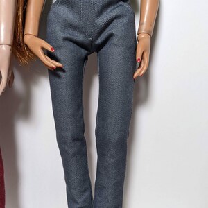 May include: A pair of dark gray denim pants with a high waist and a slim fit.