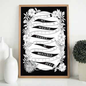 May include: Black and white printable art print with a floral design. The print features a stylized measuring tape with the text "My Worth Cannot Be Measured Here".
