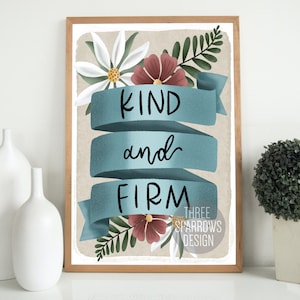 May include: A printable art print with a floral design and the text "KIND and FIRM" in blue lettering on a blue banner. The background is a light brown color. The print is framed in a light wood frame.