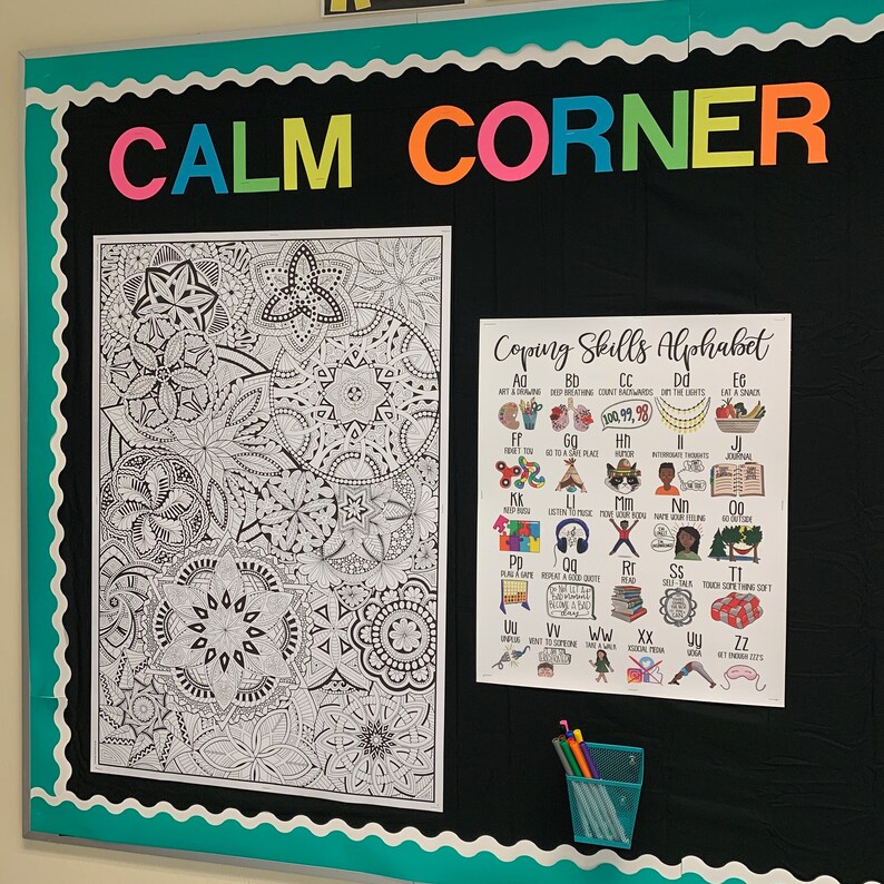 May include: A black bulletin board with the words "CALM CORNER" in colorful letters. The board has a black and white mandala coloring page and a poster with the title "Coping Skills Alphabet". The poster has a colorful alphabet with different coping skills for each letter.