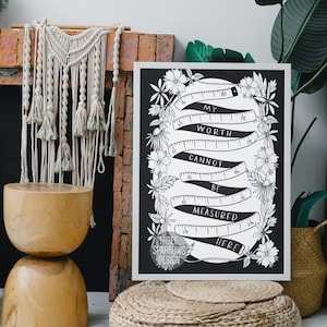 May include: Black and white printable wall art with a floral design. The text reads "My worth cannot be measured here."