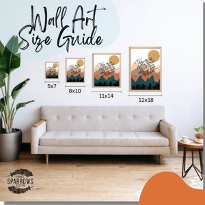 May include: Wall art size guide showing four different sizes of framed prints. The prints feature a mountain landscape with the text "There are no better things ahead than those that we leave behind." The prints are in a light wood frame with a white mount.