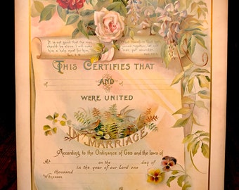 Puede incluir: Un certificado de matrimonio vintage con bordes florales y un diseño de rollo. El texto dice "Esto certifica que... fueron unidos en matrimonio de acuerdo con la Ordenanza de Dios y las leyes de... en... el... día de... mil del año de nuestro Señor... Por... Testigos."
