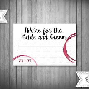 May include: White card with the text "Advice for the Bride and Groom" and "With Love" in black text. The card has a red wine stain on the right side.