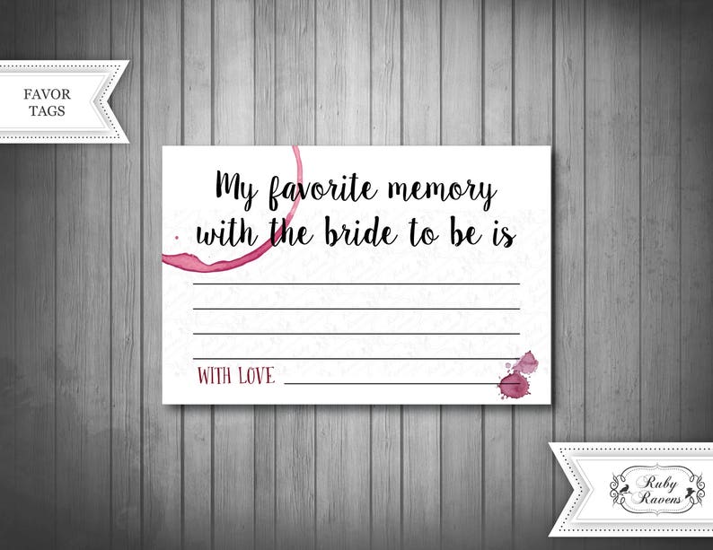 May include: White card with black text that reads "My favourite memory with the bride to be is" with a blank space for writing. The card has a red wine stain and the words "With Love" at the bottom.