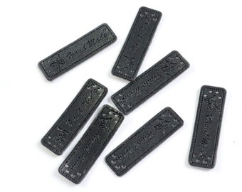 Artificial leather label patch as a patch *Handmade* on black 15 x 50 mm / (1.15/piece)