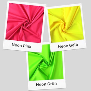 May include: Three fabric swatches in neon pink, yellow, and green. Each swatch is folded in a spiral shape.
