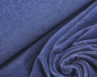 May include: A deep blue fabric featuring a distinct vertical ribbed texture. The material is draped in soft folds, showcasing the consistent linear pattern and the rich, saturated color of the textile across its surface in a close-up view.