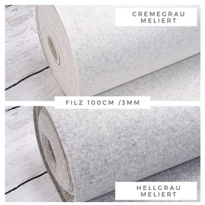 May include: Two rolls of felt fabric, one cream grey and one light grey, both with a mottled texture. The fabric is 100 cm wide and 3 mm thick. The text "FILZ 100CM / 3MM" is printed on a white label.