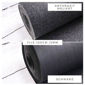May include: Two rolls of felt fabric, one black and one grey, with the text "FILZ 100CM / 3MM" and "ANTHRAZIT MELIERT" and "SCHWARZ" on the labels.