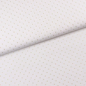 May include: White fabric with a pattern of small, evenly spaced gold dots. The fabric is folded, showing the texture and drape of the material. The dots are consistent in size and color, creating a simple yet elegant design.