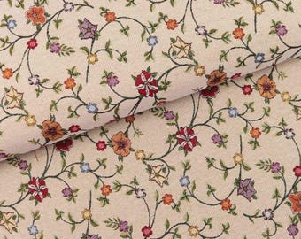 May include: Beige fabric with a floral pattern featuring small, colorful flowers and vines. The fabric has a textured, woven look.