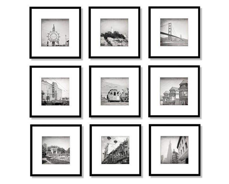 May include: A black and white photo collage of nine different images of San Francisco landmarks. The images include the Golden Gate Bridge, a cable car, a street scene, and a building with a sign that says "Castro".