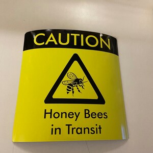 Square Bees in Transit Sign, made of magnetic material with outdoor use vinyl finish, this long lasting sign is ideal for repeated use on vans, cars and other forms of transport to warn of your precious cargo. This can be used in the same way as an L Plate and can be clipped onto any magnetic surface and also safely removed and used repeatedly.