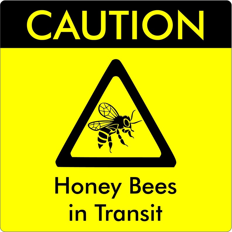 Magnetic bees in transit sign for repeated use on cars, vans and other transport. Size is approx. 195mm,7.7 inches wide, 195mm,7.7 inches high. Yellow vinyl with black text in vinyl. Triangular warning sign with bee. Image shows sign on background