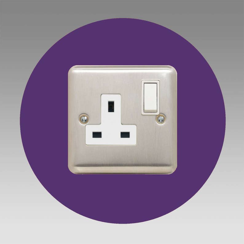 Socket surround round single made from 3mm thick acrylic in a choice of more than 16 colour options. 40mm border. Image shows purple light and socket switch surround in round