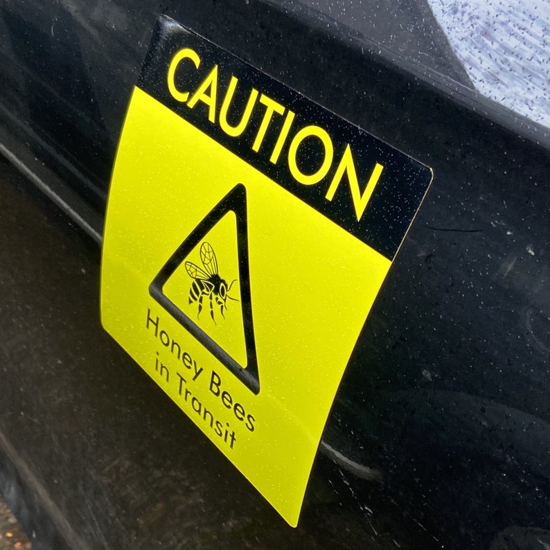 Square Bees in Transit Sign, made of magnetic material with outdoor use vinyl finish, this long lasting sign is ideal for repeated use on vans, cars and other forms of transport to warn of your precious cargo. This can be used in the same way as an L Plate and can be clipped onto any magnetic surface and also safely removed and used repeatedly.