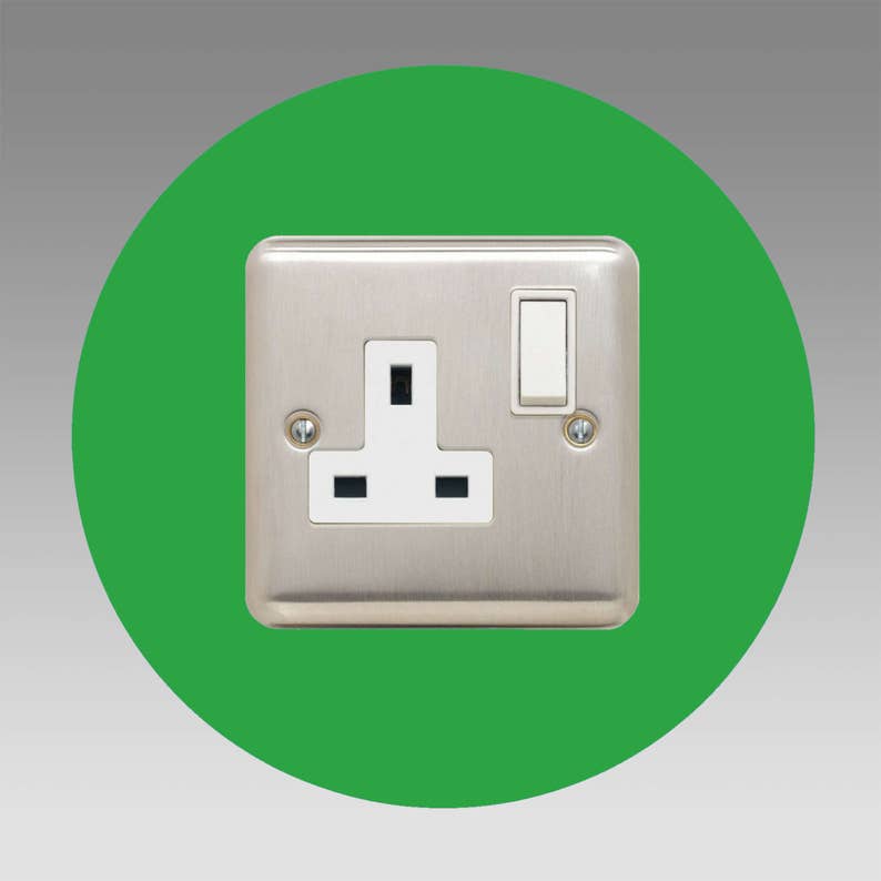 Socket surround round single made from 3mm thick acrylic in a choice of more than 16 colour options. 40mm border. Image shows light green